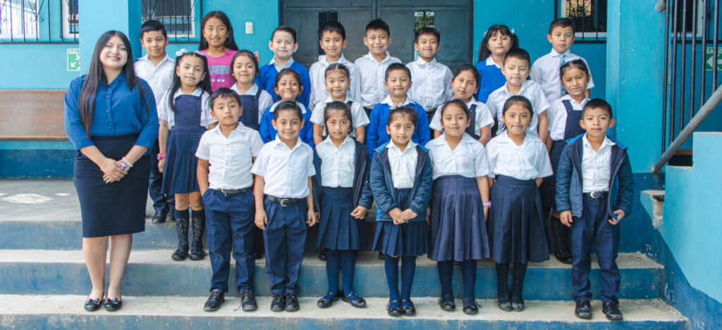 A Grade Three Class picture with Guatemalan School Children in School Uniform