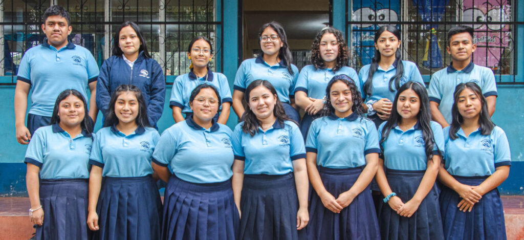 Guatemalan adolescents in school uniforms lined up for class picture